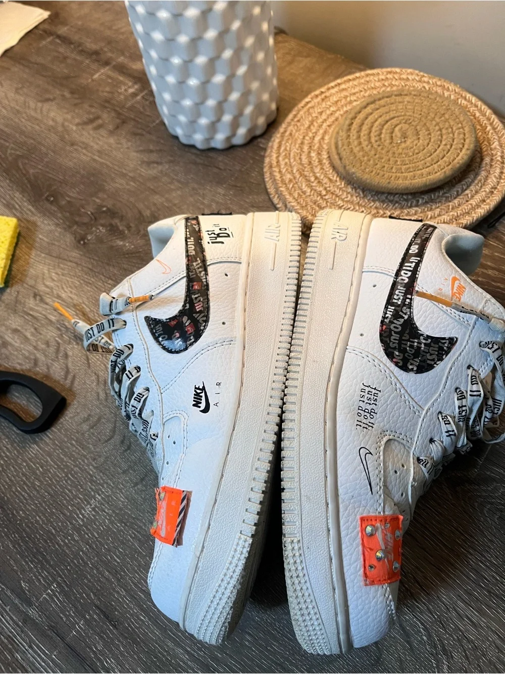 Nike Women's White Low-Top Sneakers with Black Logo and Orange Accents
